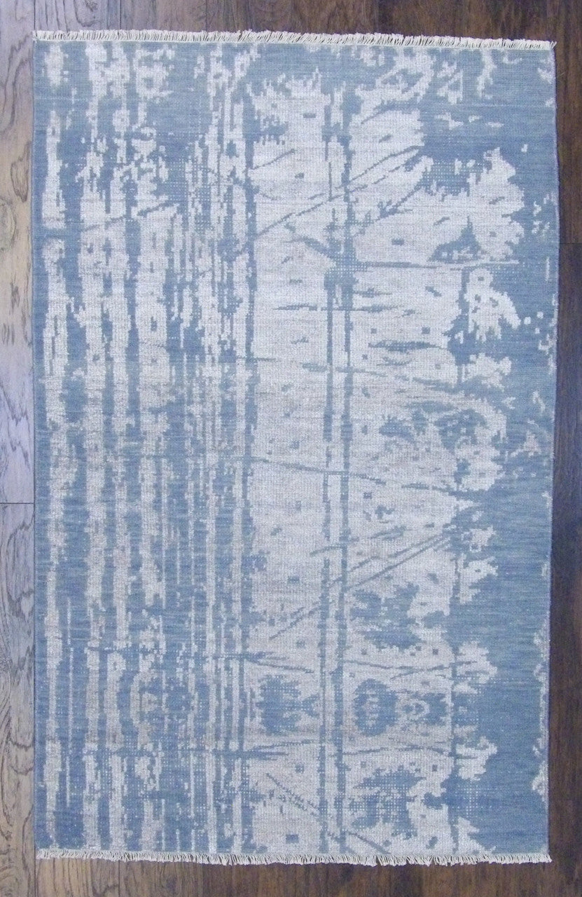 Transitional abstract design hand-knotted wool rug in blue and gray, full view