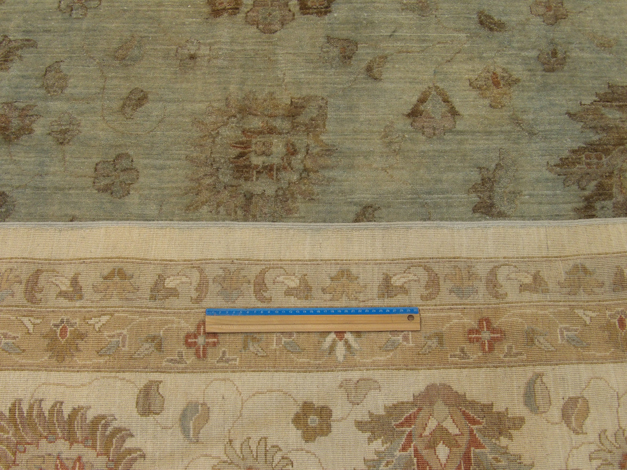 Gray and teal Chobi rug in room setting