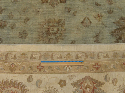 Gray and teal Chobi rug in room setting