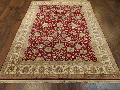 Close-up of wool pile, beige and red rug