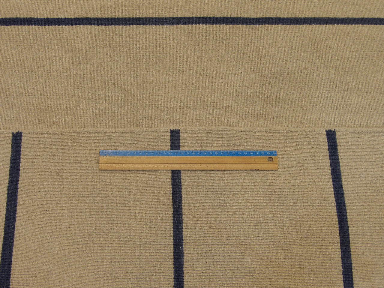 Full room view of blue coastal flat weave hand-knotted rug