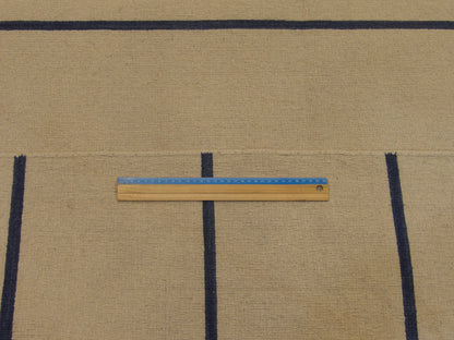 Full room view of blue coastal flat weave hand-knotted rug