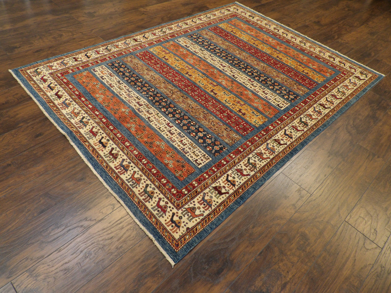 Khorasan tribal pattern detail, blue and ivory rug