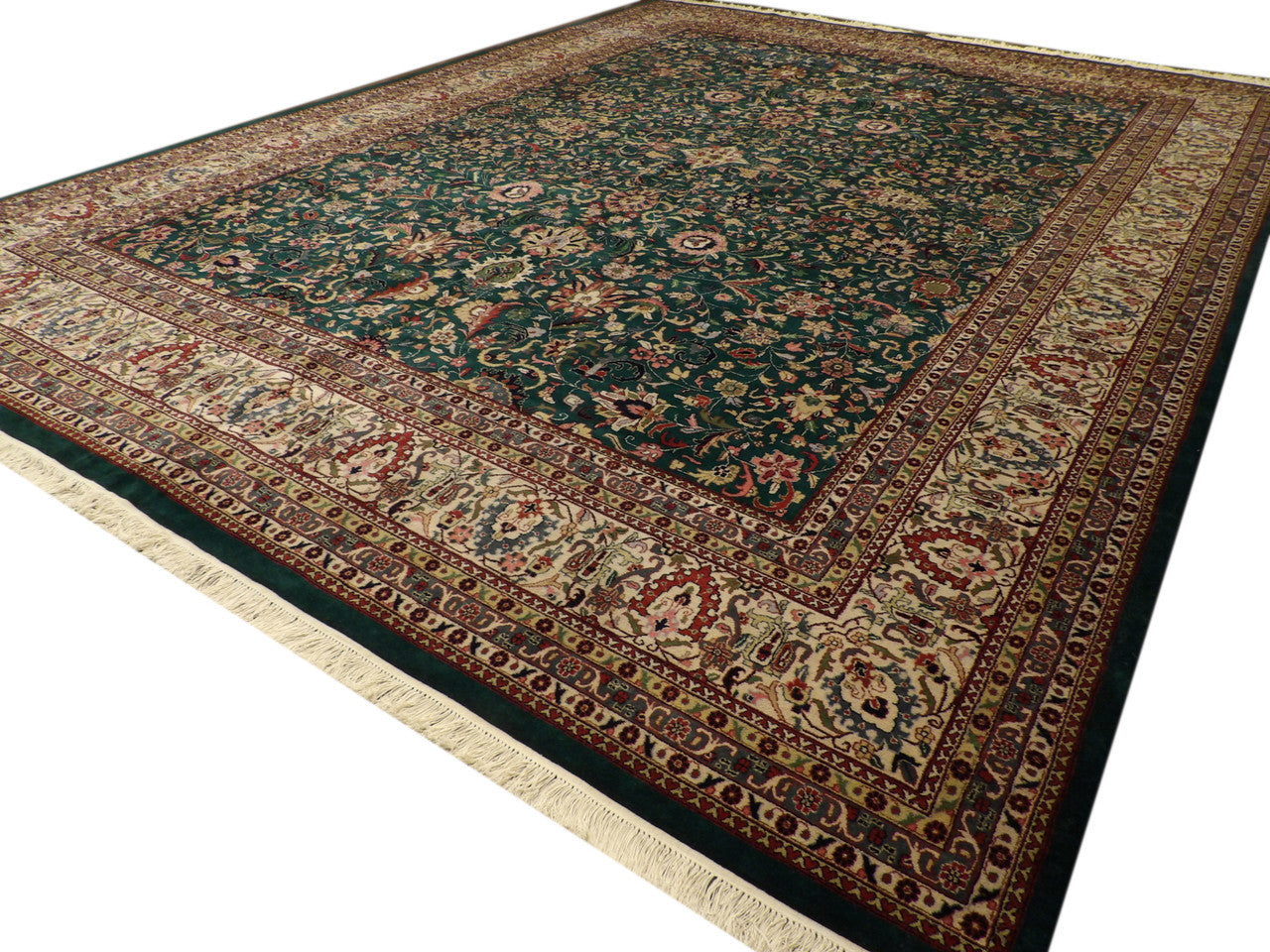 Kashan medallion pattern detail, green and beige rug