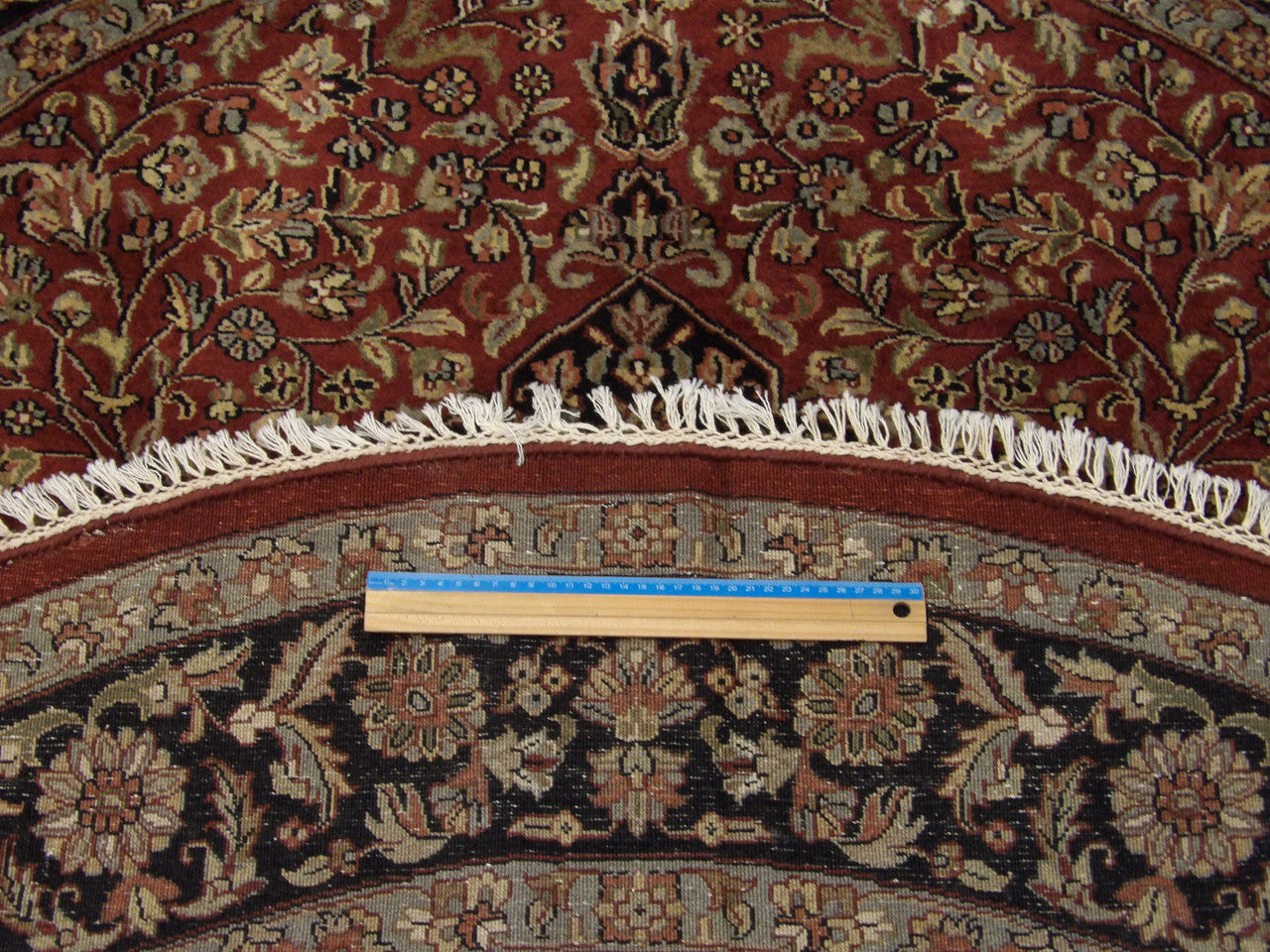 Black & Red Fine Persian Tabriz rug in room setting