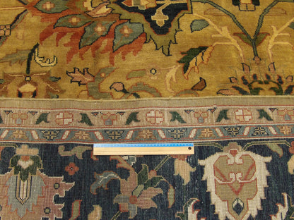 Blue and gold Ziegler rug in room setting