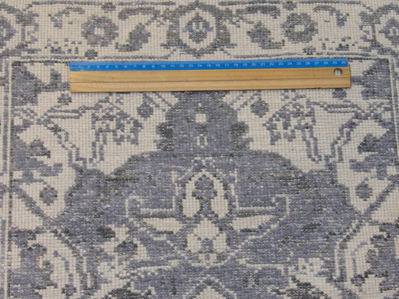 Blue & White Oushak rug in room setting