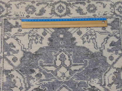 Blue & White Oushak rug in room setting