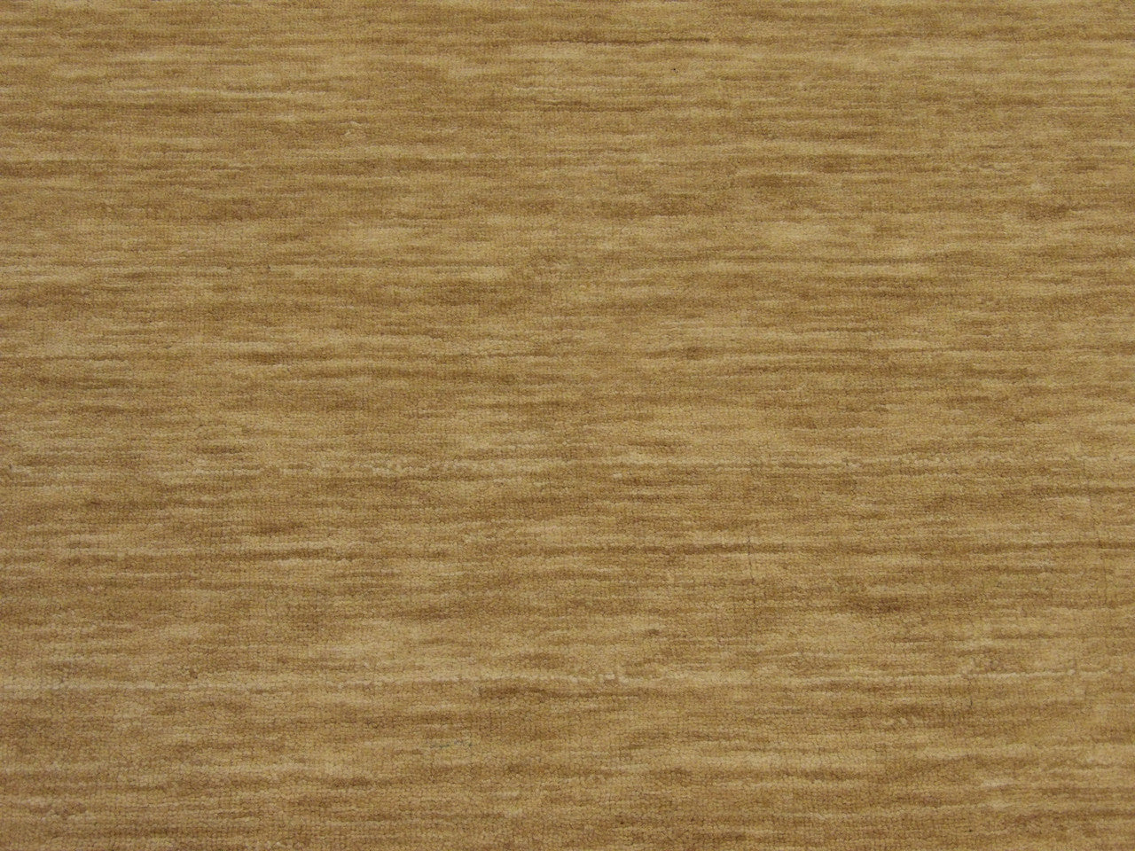 Moroccan rug edge and fringe detail, beige and gold