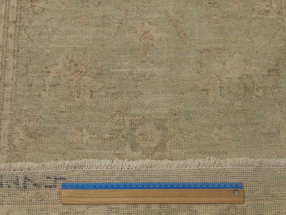 Green & Ivory Oushak Chobi Wash rug in room setting