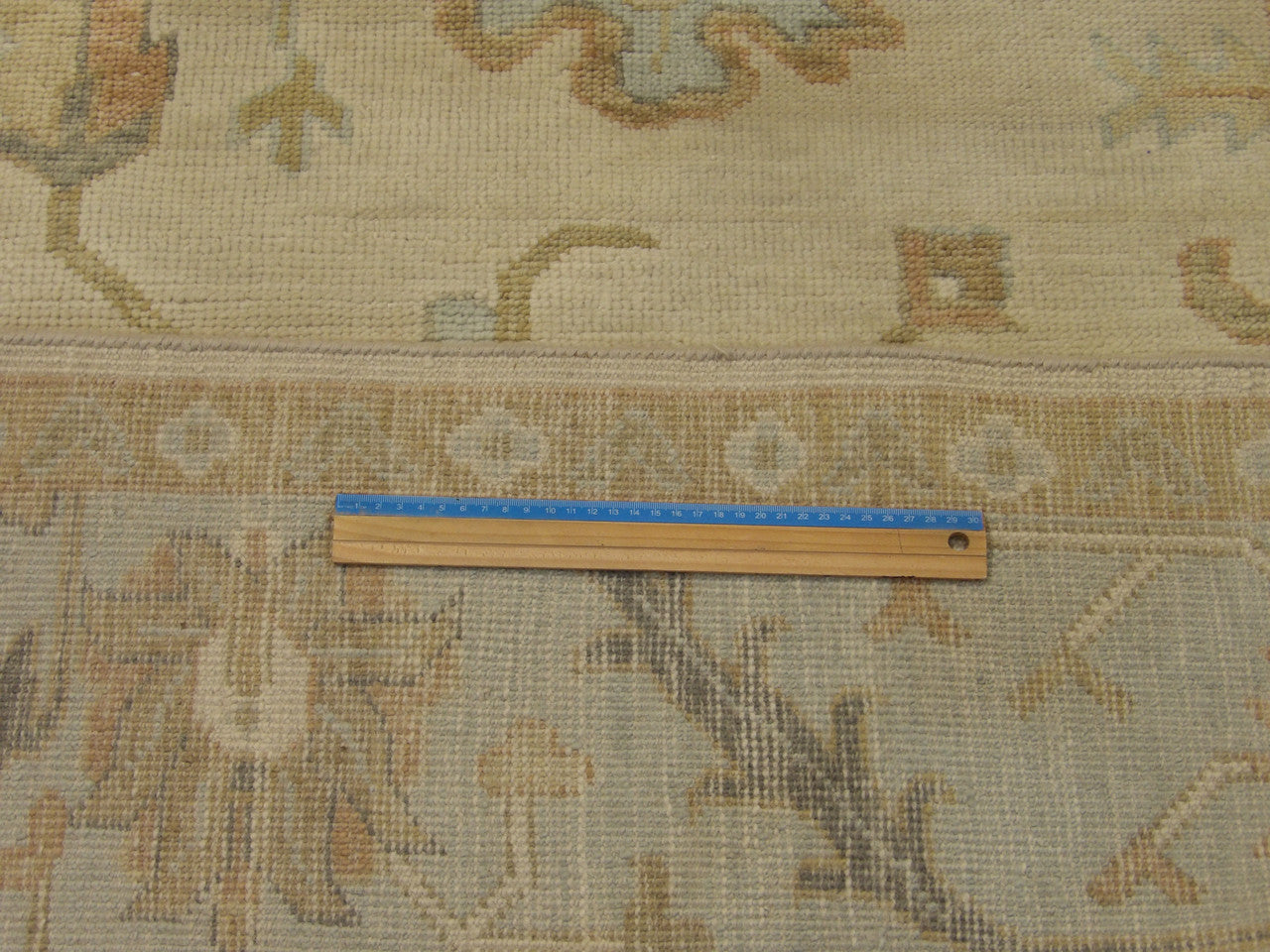 Full room view of Anatolian Oushak silver wash hand-knotted rug