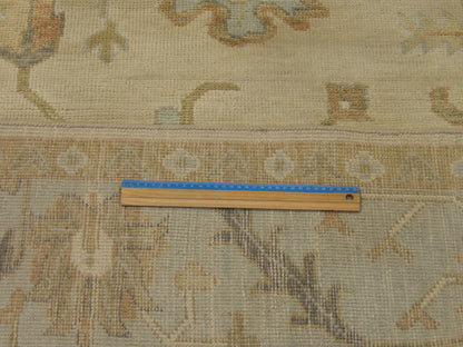 Full room view of Anatolian Oushak silver wash hand-knotted rug