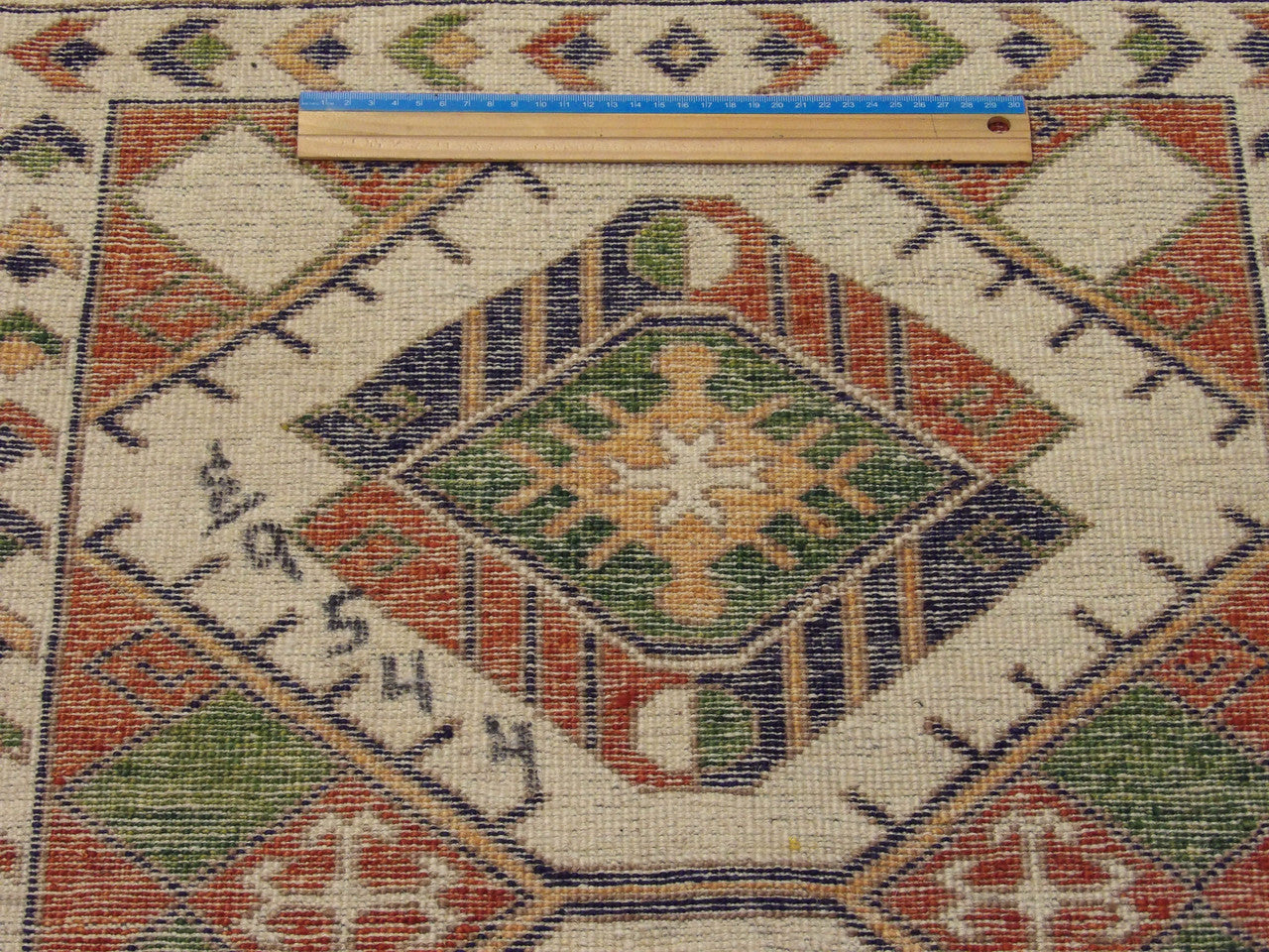 Beige & Rust Tribal Super Kazak Natural Dye rug in room setting