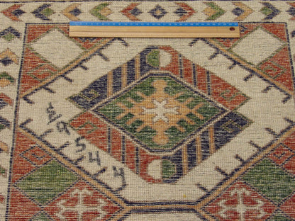 Beige & Rust Tribal Super Kazak Natural Dye rug in room setting