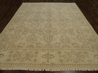 Close-up of wool pile, green and beige rug