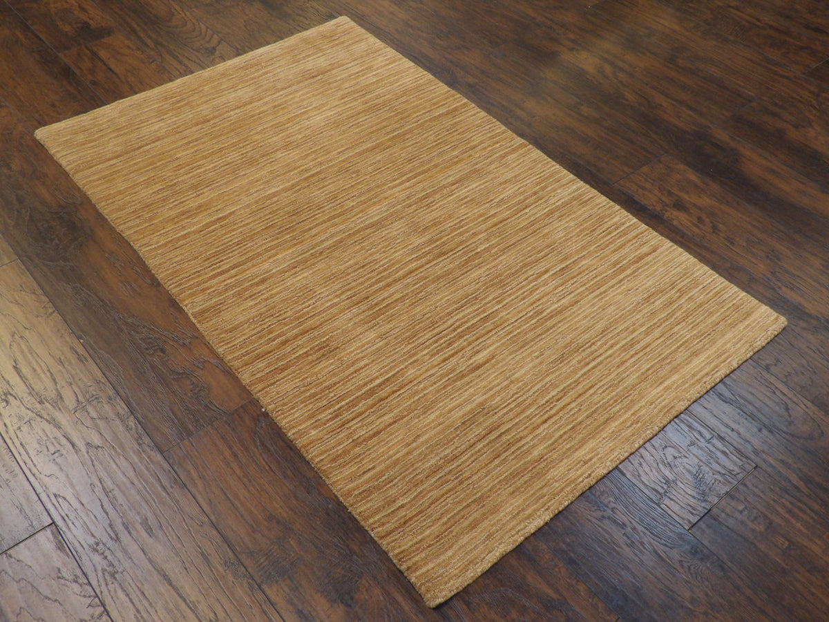 Full view of modern hand-knotted rug in brown