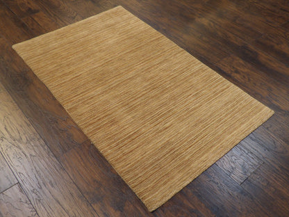 Full view of modern hand-knotted rug in brown