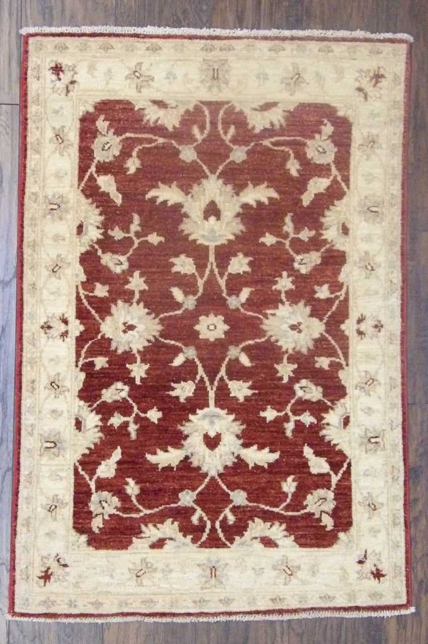 Oushak Chobi hand-knotted wool rug in beige and red, full view