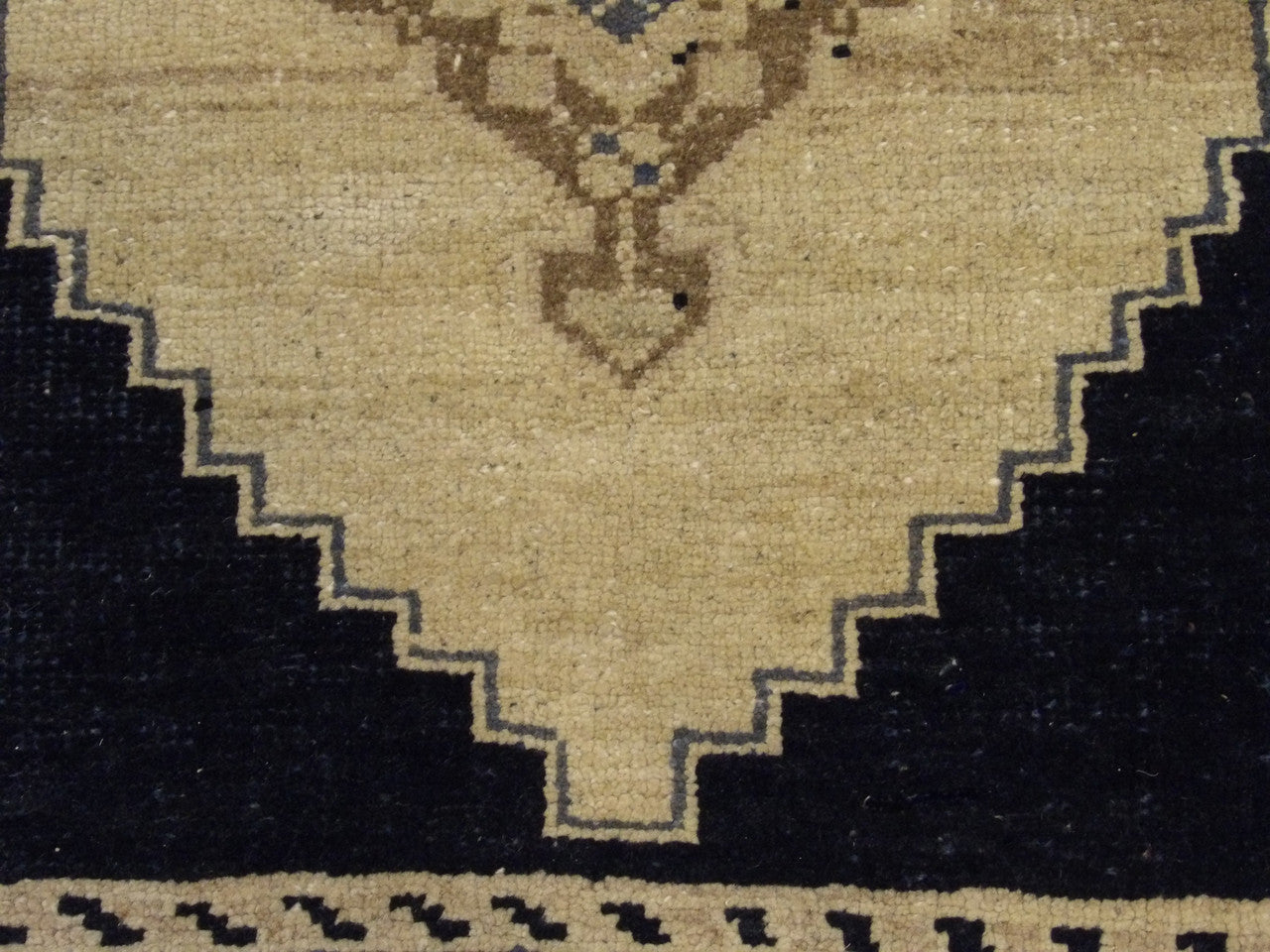 Yastik rug edge and fringe detail, beige and black