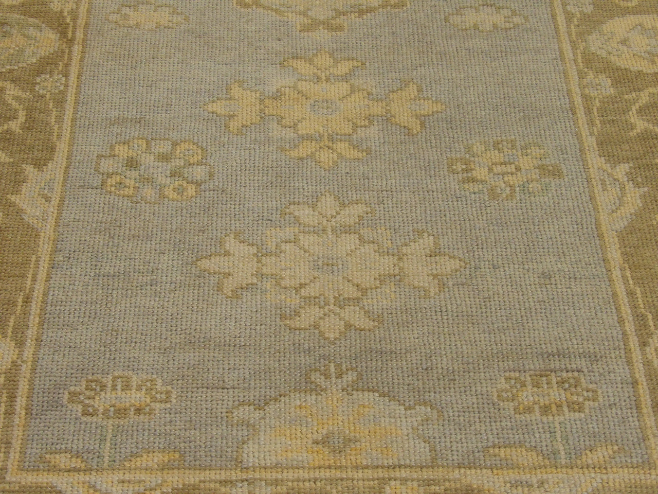 Vintage Oushak wool texture close-up