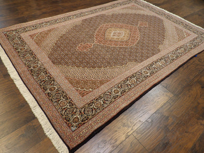 Black Mahi Tabriz rug in a formal living room setting
