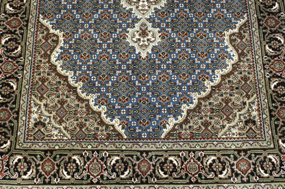 Black & Blue Traditional Tabriz rug in room setting