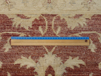 Beige and red Oushak rug in room setting