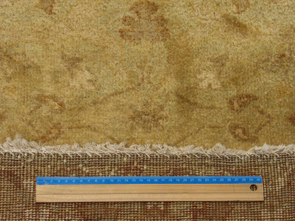 Brown and gold Oushak runner in hallway setting