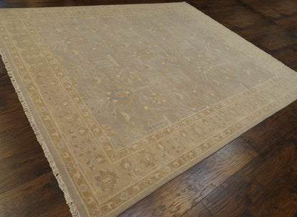 Beige and gray Oushak Chobie rug in a living room setting