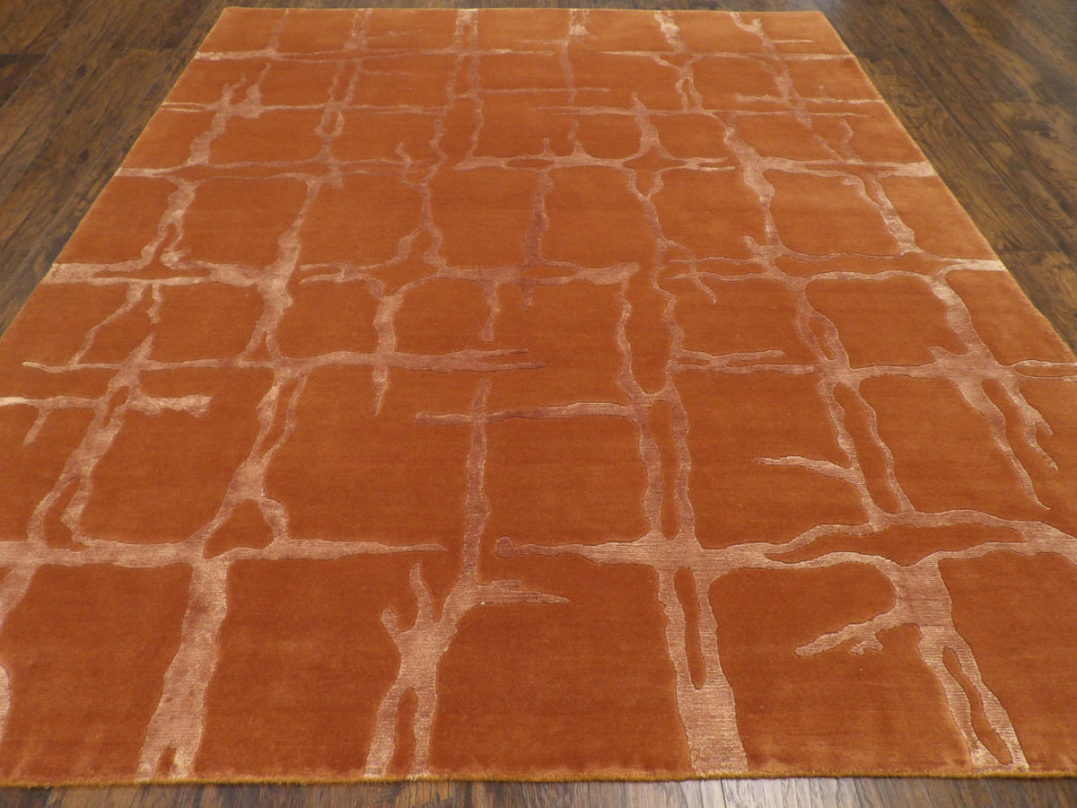 Close-up of wool-silk pile, rust rug