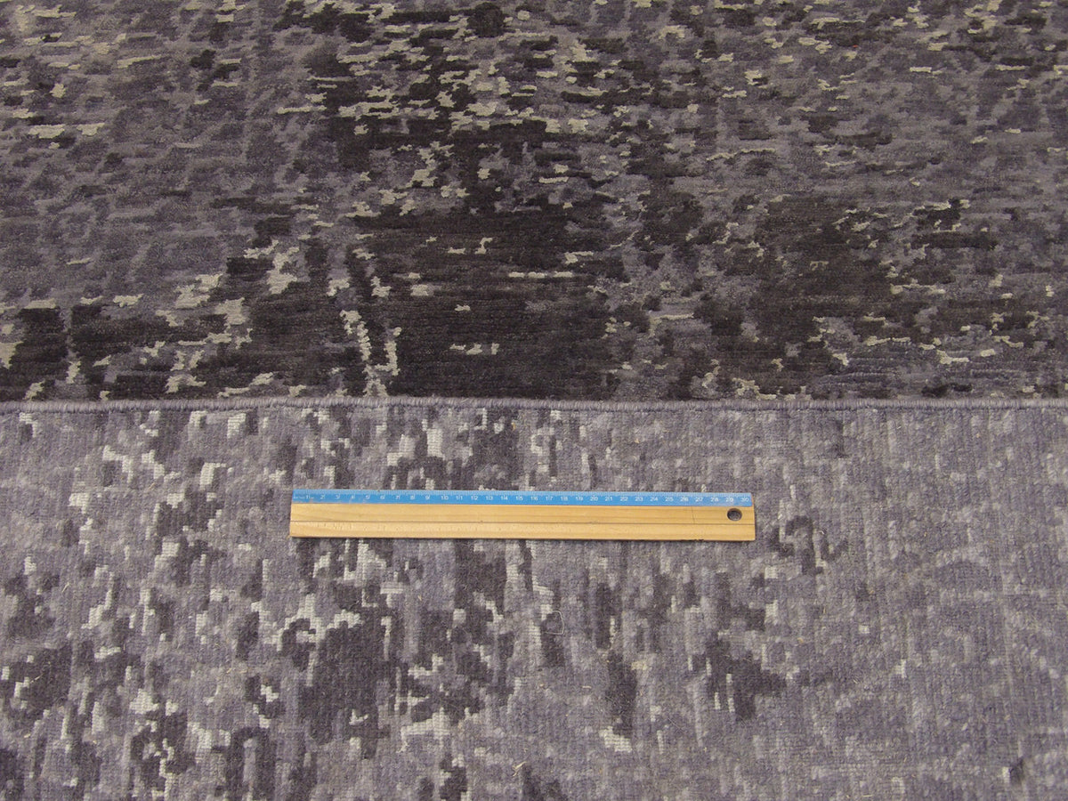 Black and gray mosaic rug in room setting