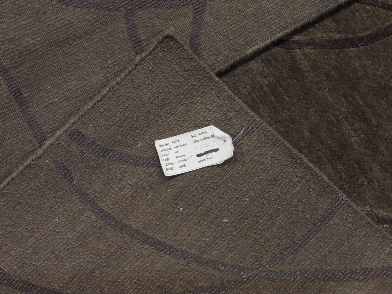 Gray and purple Tibetan rug in room setting