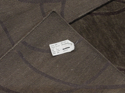 Gray and purple Tibetan rug in room setting