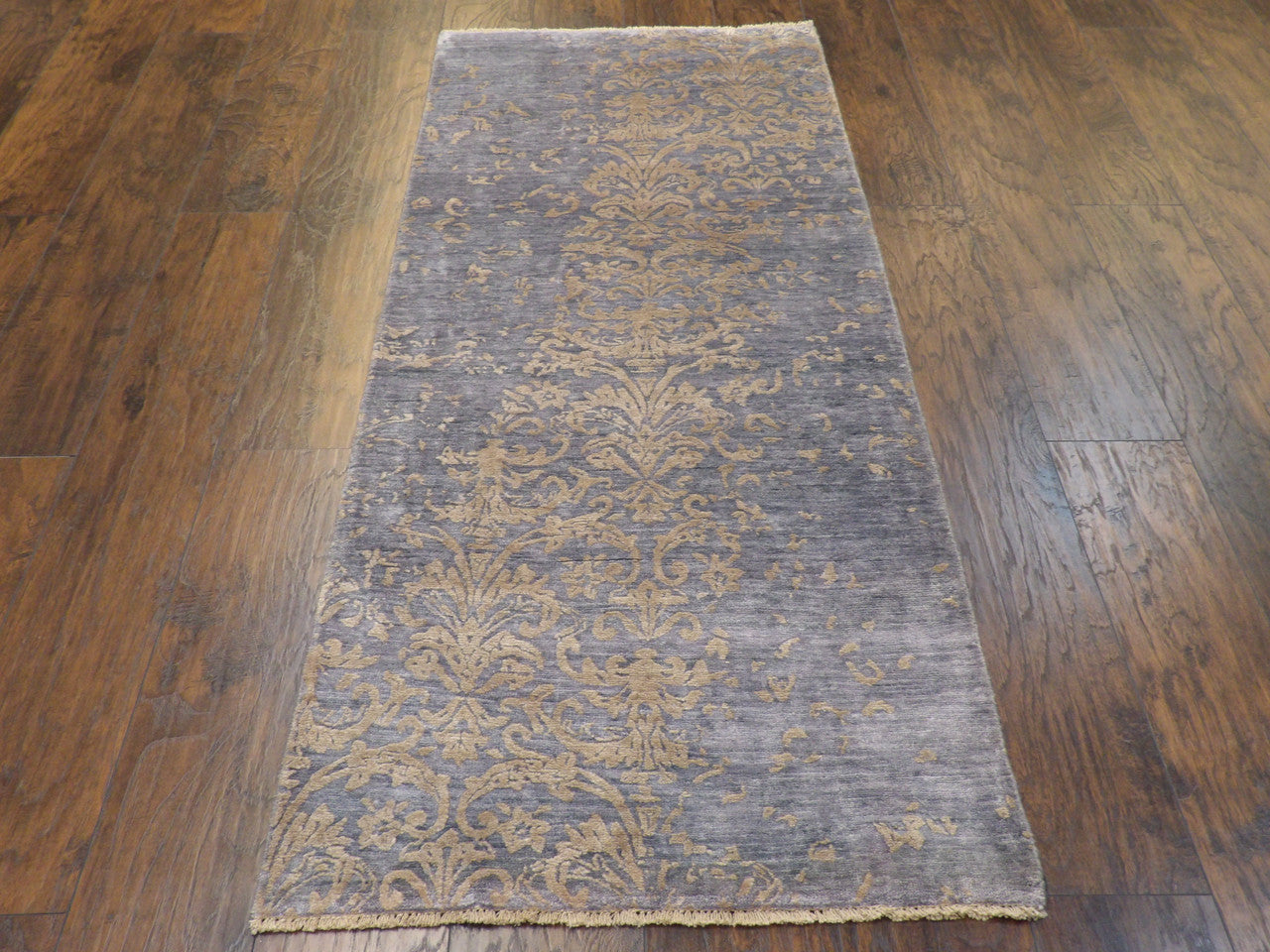 Gray and beige damask runner in hallway setting