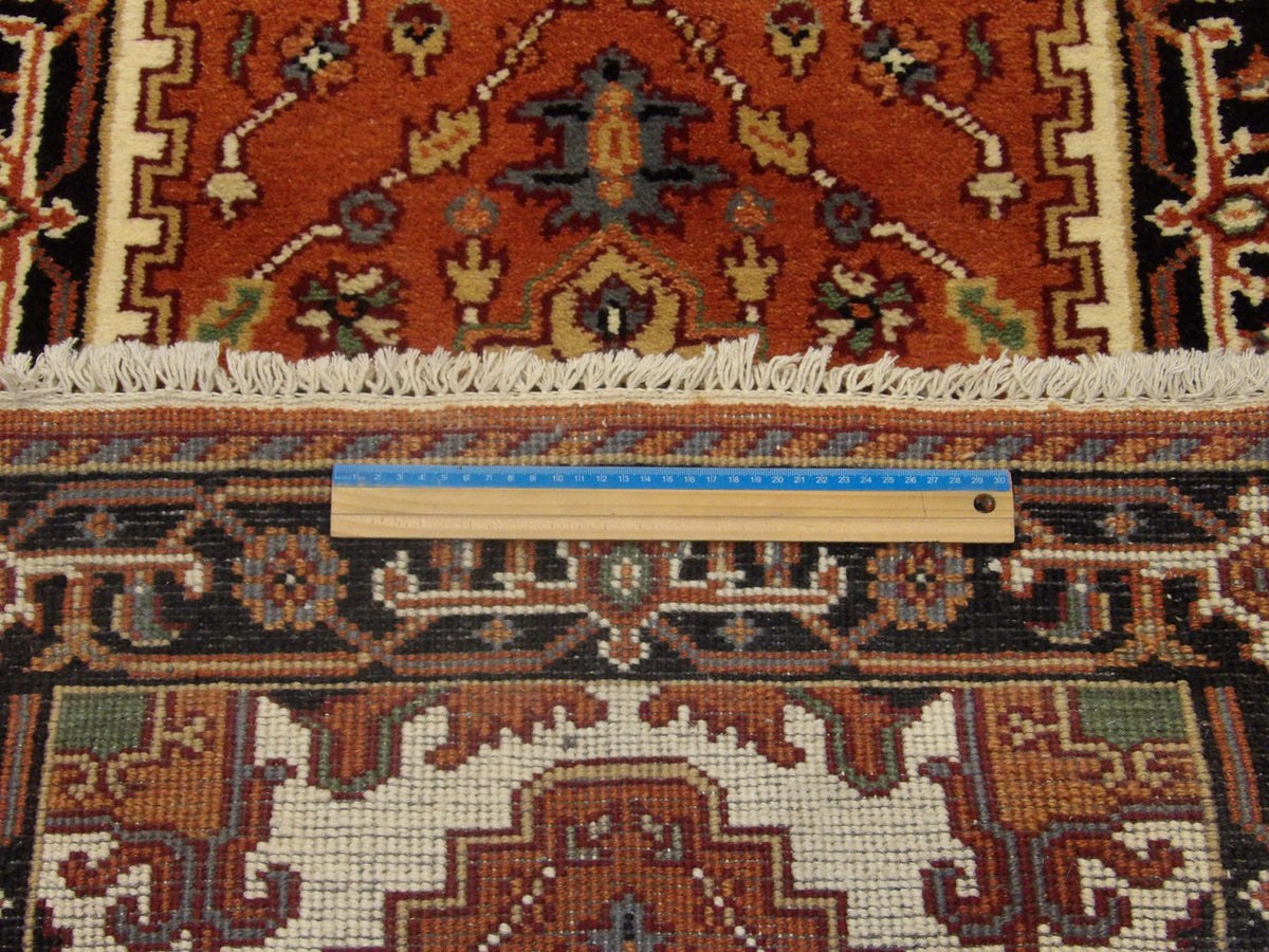 Blue & Rust Tribal Heriz rug in room setting