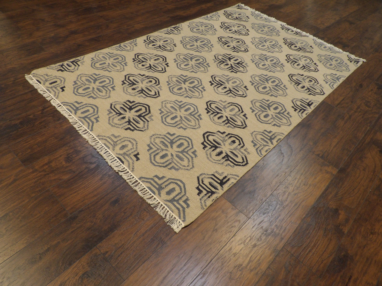 Gold coastal flatweave rug in a sunroom setting