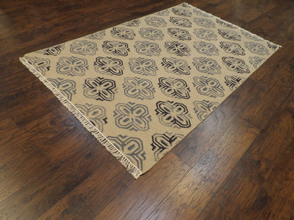 Gold coastal flatweave rug in a sunroom setting