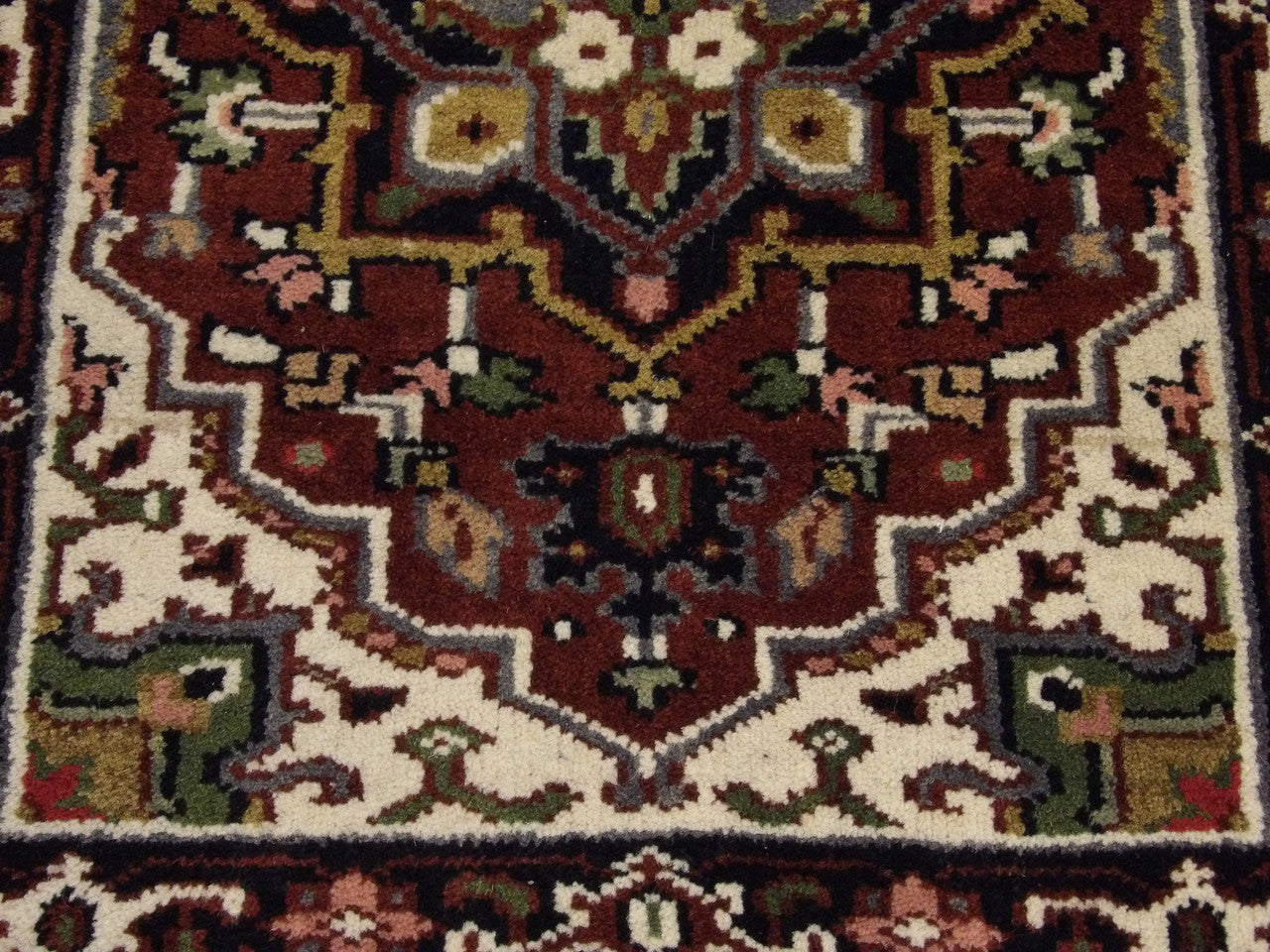 Tribal Heriz rug border detail