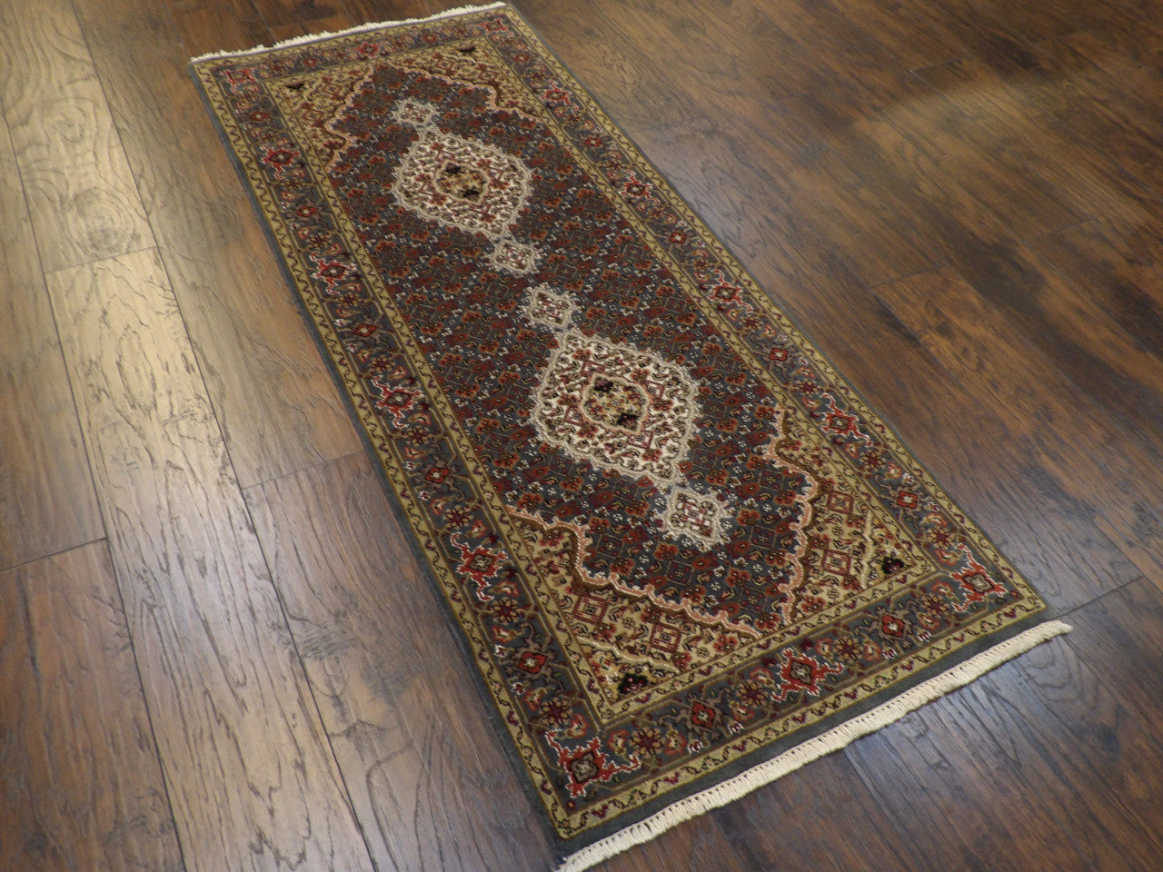 Back of hand-knotted Mahi Tabriz runner showing construction