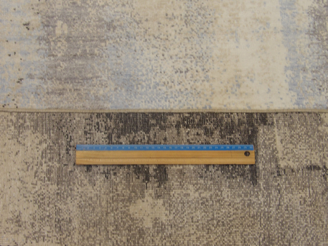 Blue and gray abstract rug in room setting