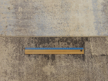 Blue and gray abstract rug in room setting