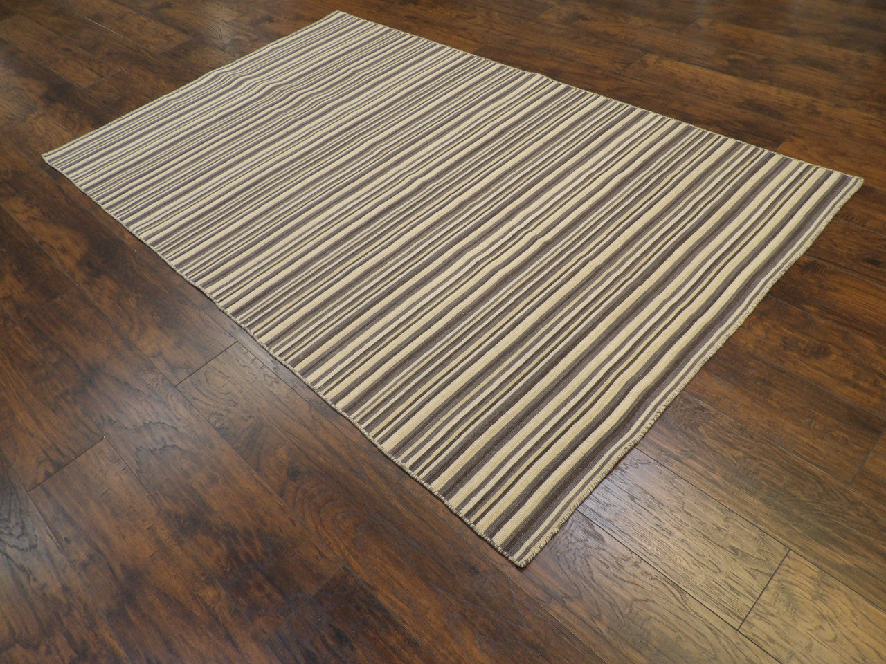 Blue coastal flatweave rug in a sunroom setting