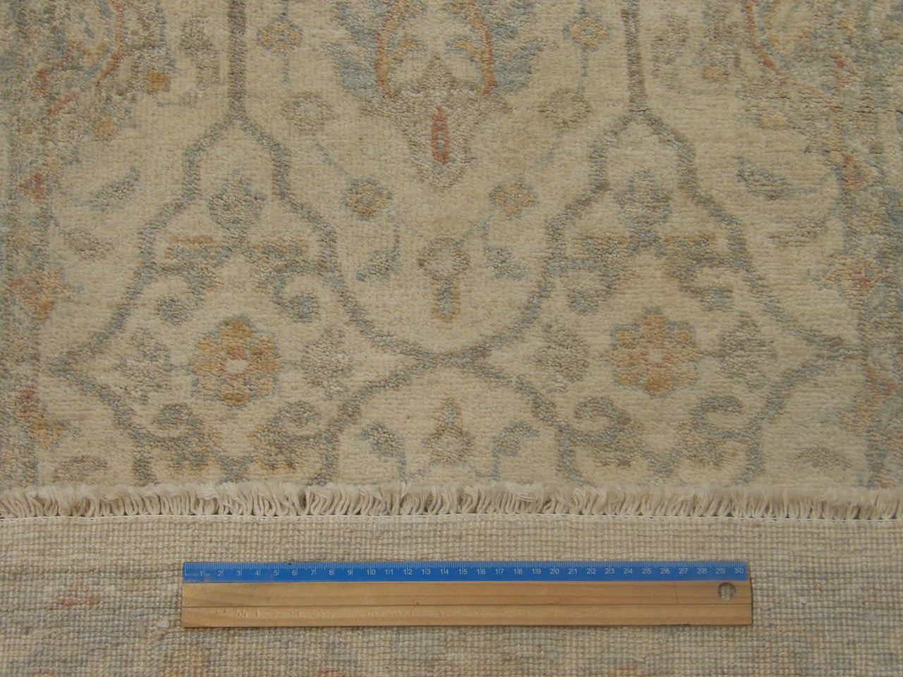 Blue and ivory Oushak runner in hallway setting