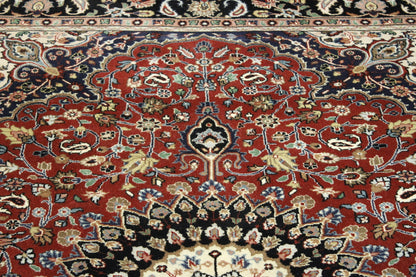 Black & Red Traditional Fine Qum rug in room setting