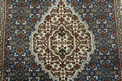 Traditional Tabriz rug corner detail