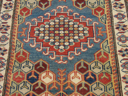 Tribal Kazak rug border detail