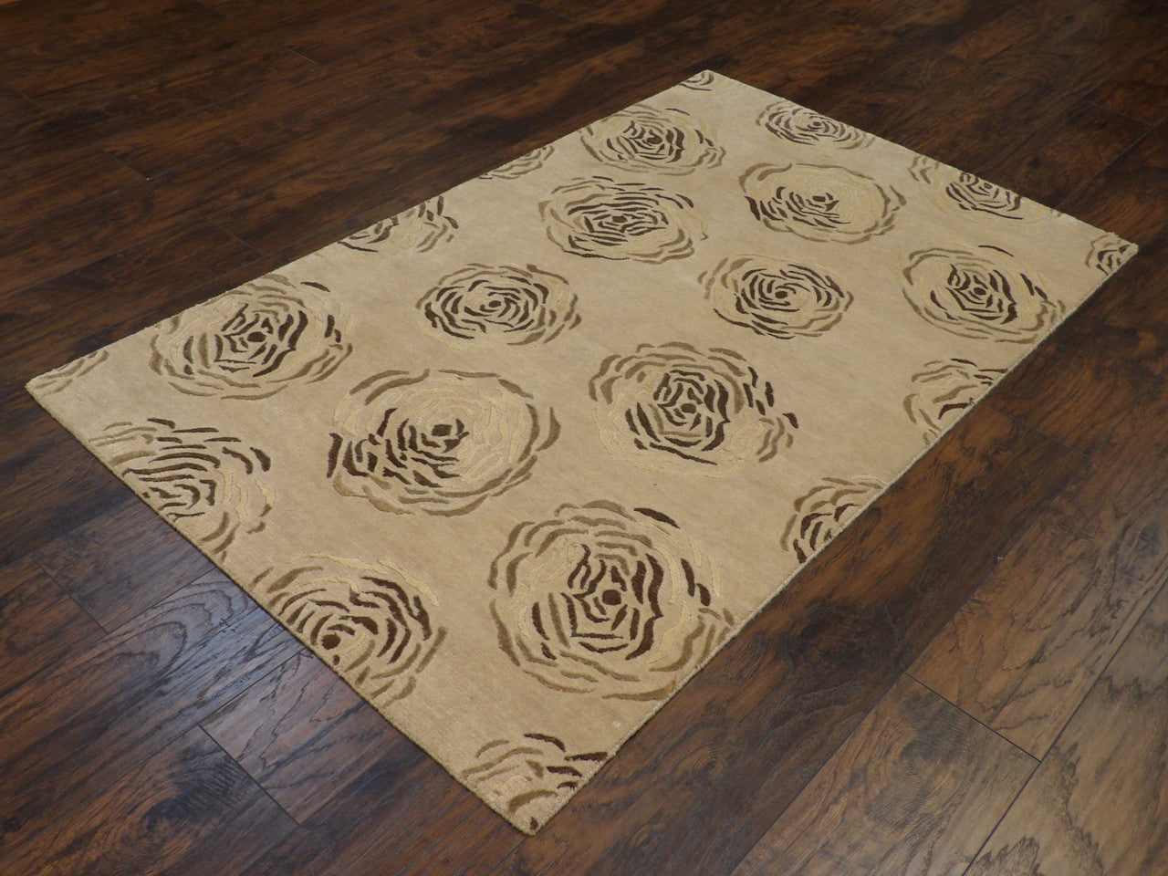 Rose pattern detail, brown rug