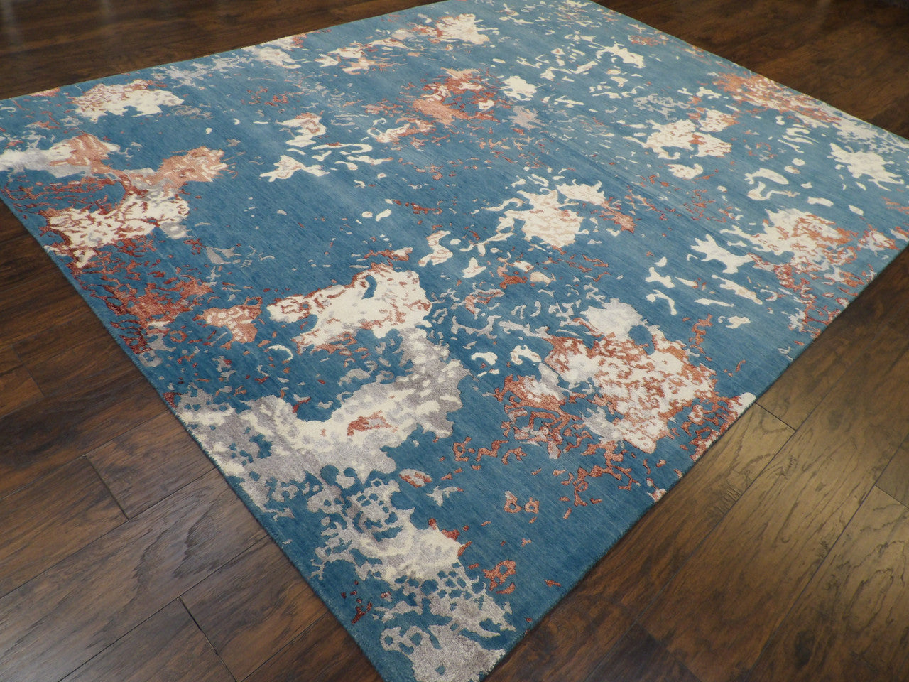 Abstract broken pattern detail, rust rug