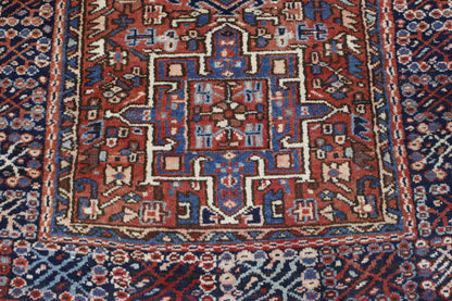 Traditional Antique Heriz rug corner detail