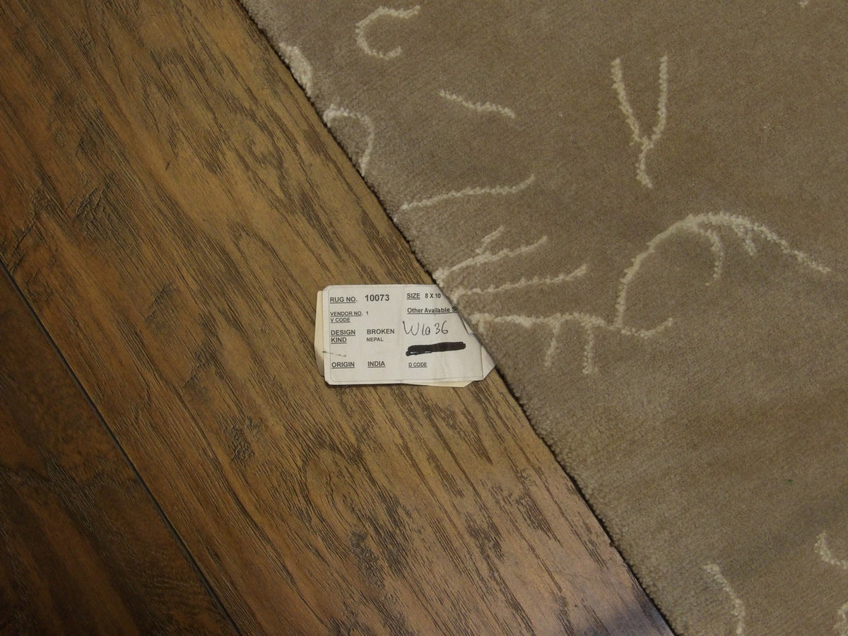 Full room view of transitional broken design hand-knotted rug
